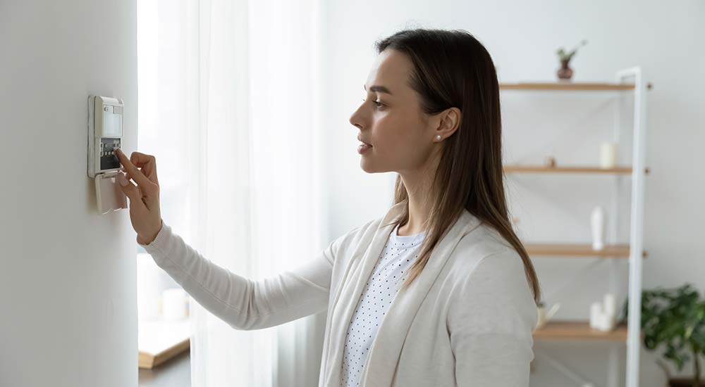 Renter turning on her security alarm