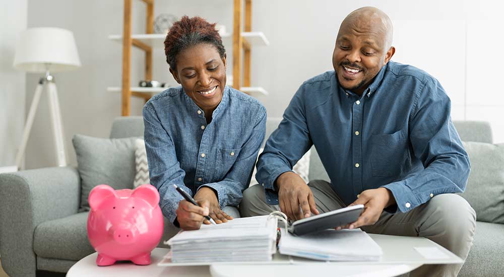 Small business owners looking at their paperwork