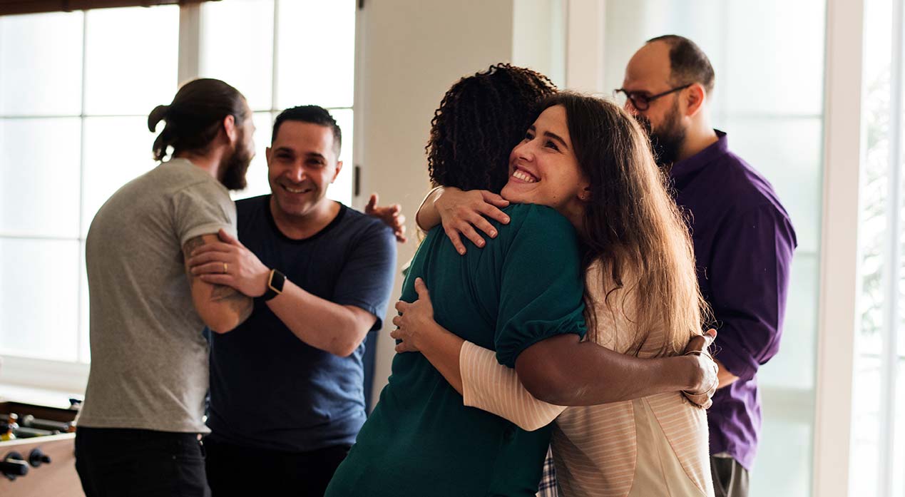 Group of people hugging