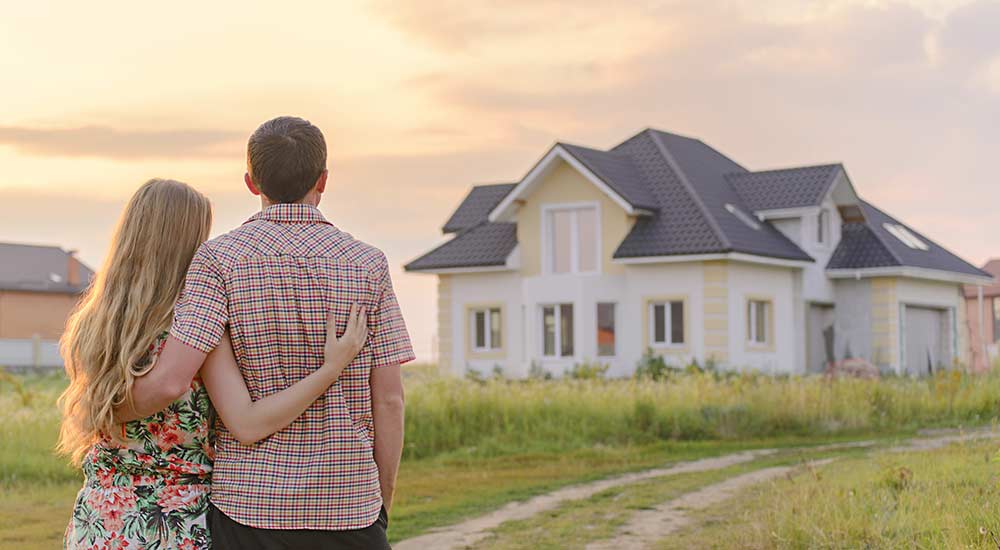 Two people looking at a home