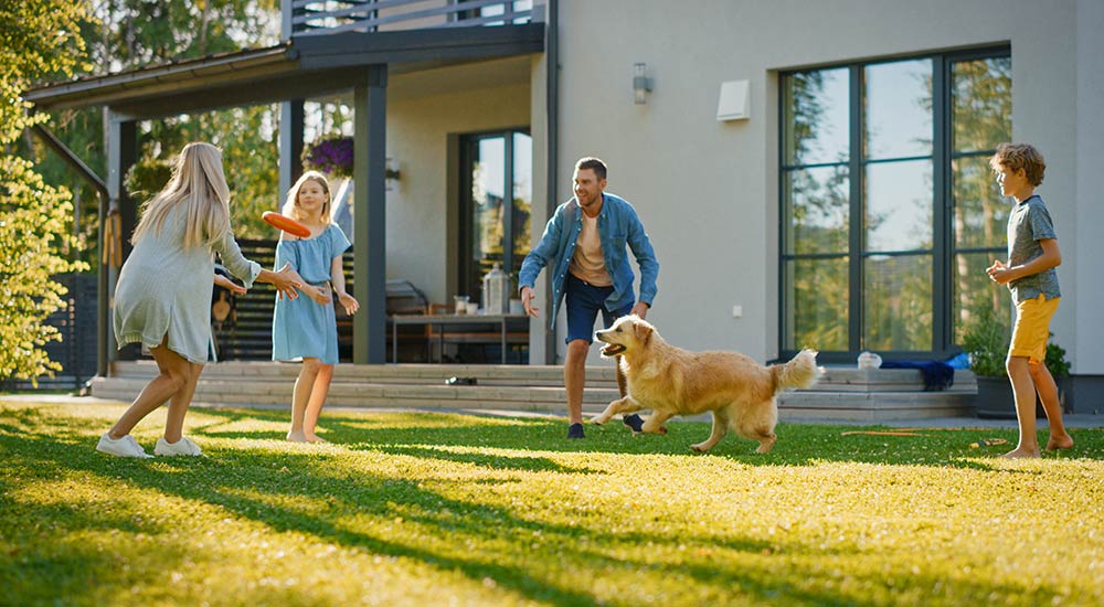 Family playing with their dog at home