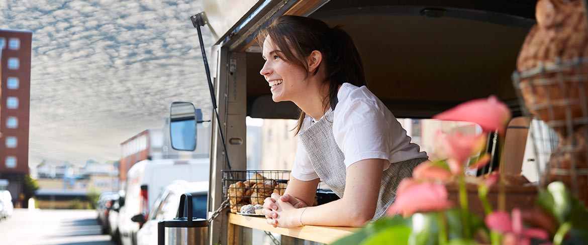 Woman at the window of her food truck