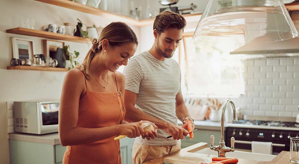 Couple cooking in kitchen 