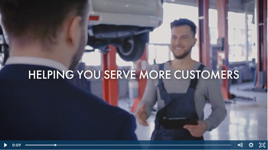 Auto shop business owner greeting a customer